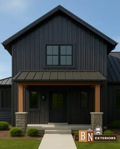 Modern home with dark vertical steel siding and a covered entry