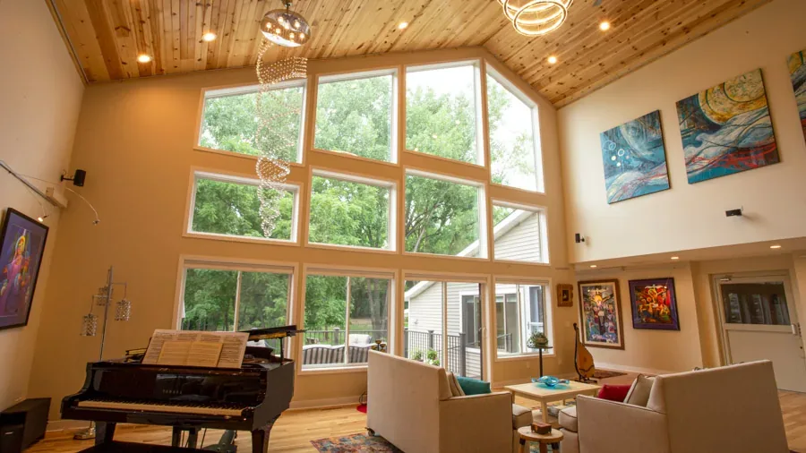 Vaulted great room with tall windows and clerestory glass