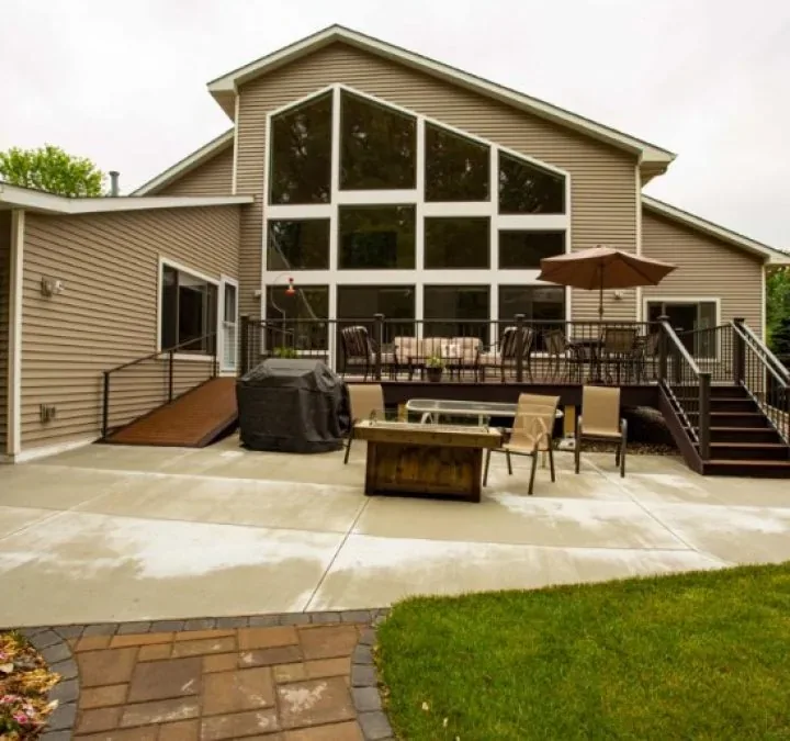 Beige home with a large custom geometric window wall